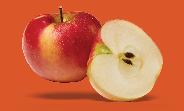 One whole apple and another apple cut in half