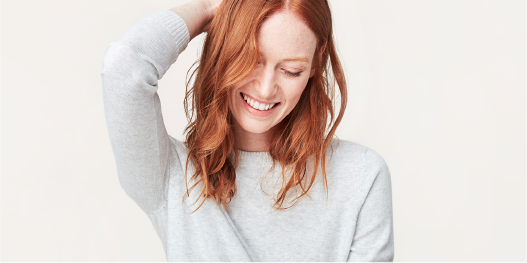 Woman in gray sweater