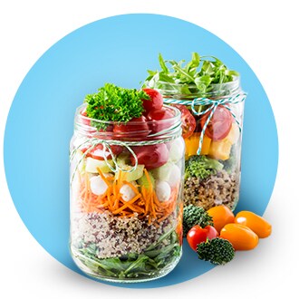 Mason jars filled with vegetables on blue bubble background