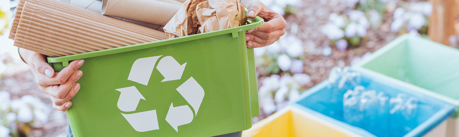 Recycle bins with recyclable items in them