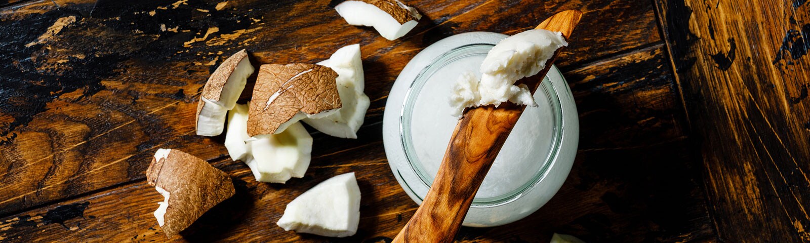 Coconut oil on a wooden table Coconut oil on a wooden table