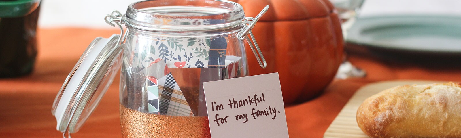 A mason jar filled with patterned handwritten cards